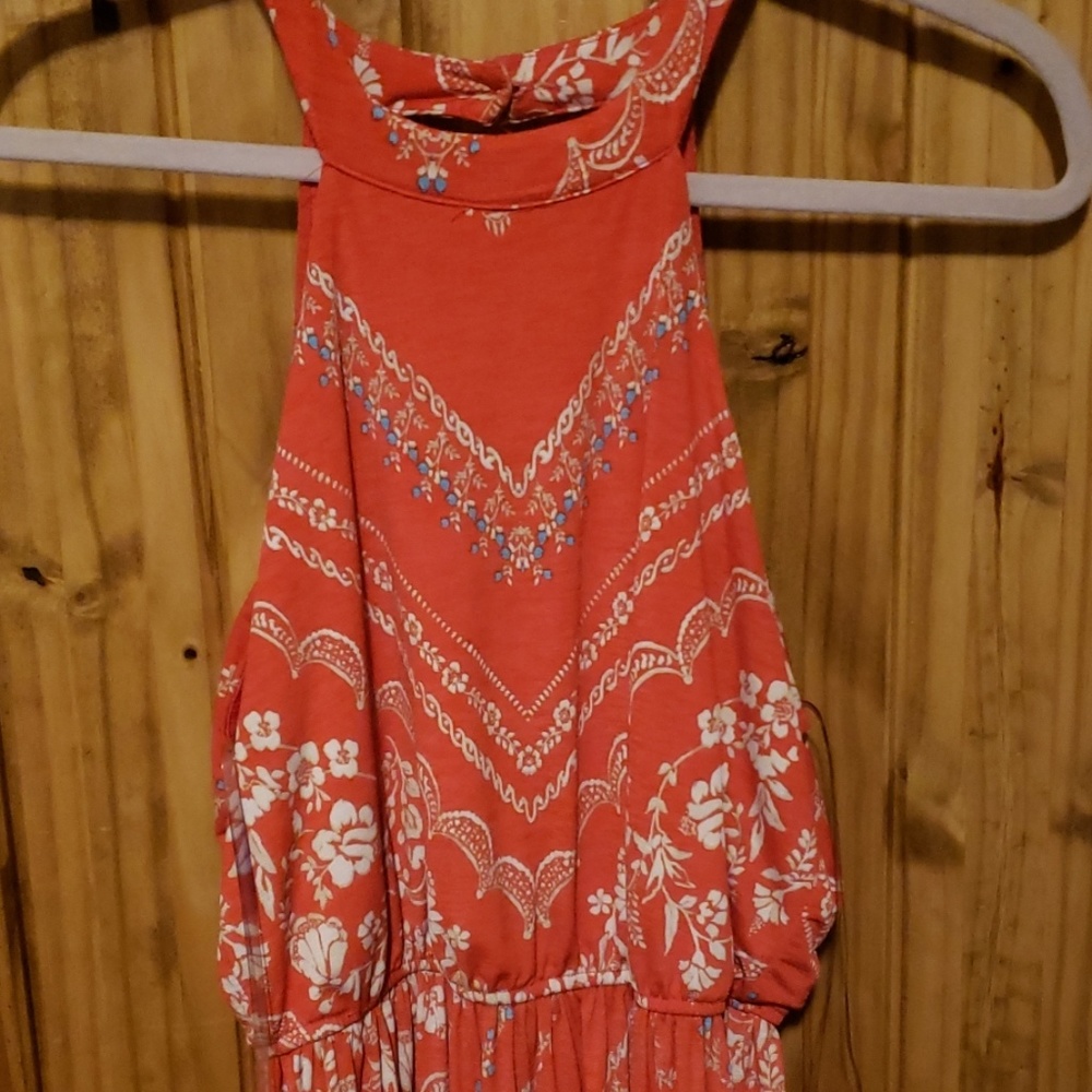 Pink maxi dress with floral pattern.